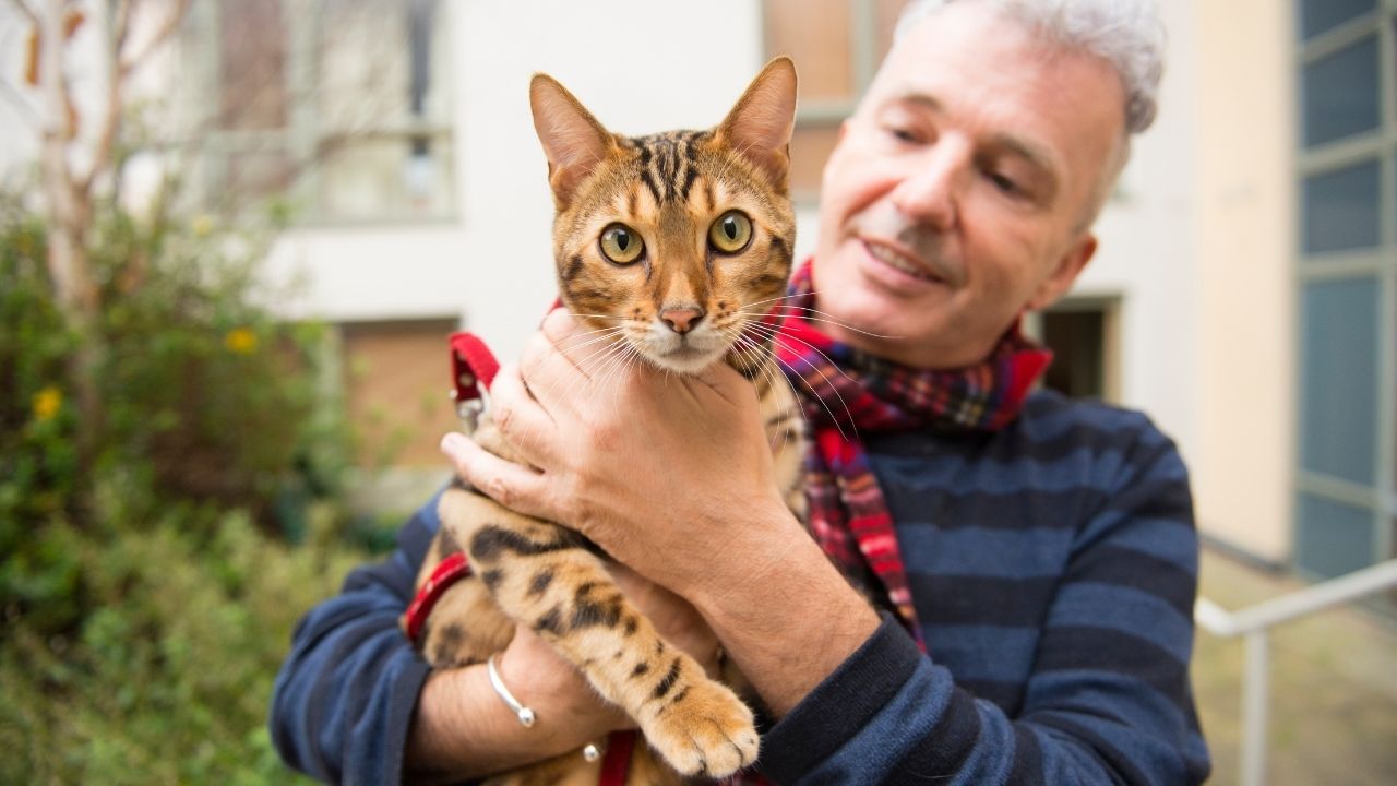 man holding cat