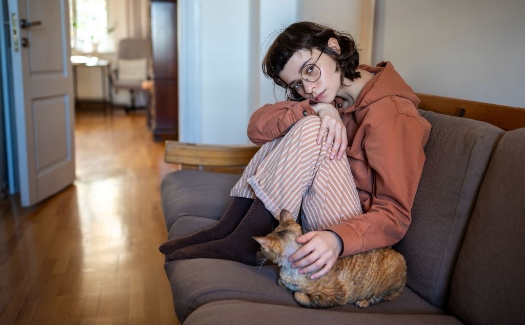 girl petting emotional support cat