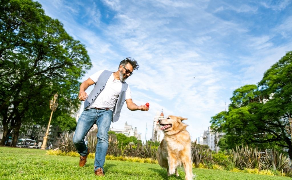 guy sitting with emotional support doggie