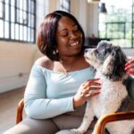 middle woman with emotional support dog