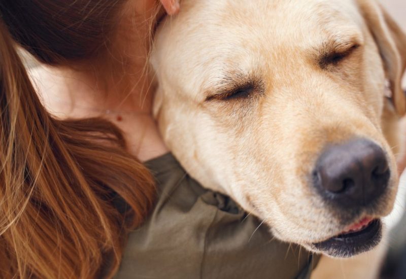 woman hugging her ESA dog